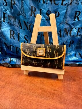 Dooney & Bourke Black Wallet with Yellow Trim and Logo Plaque